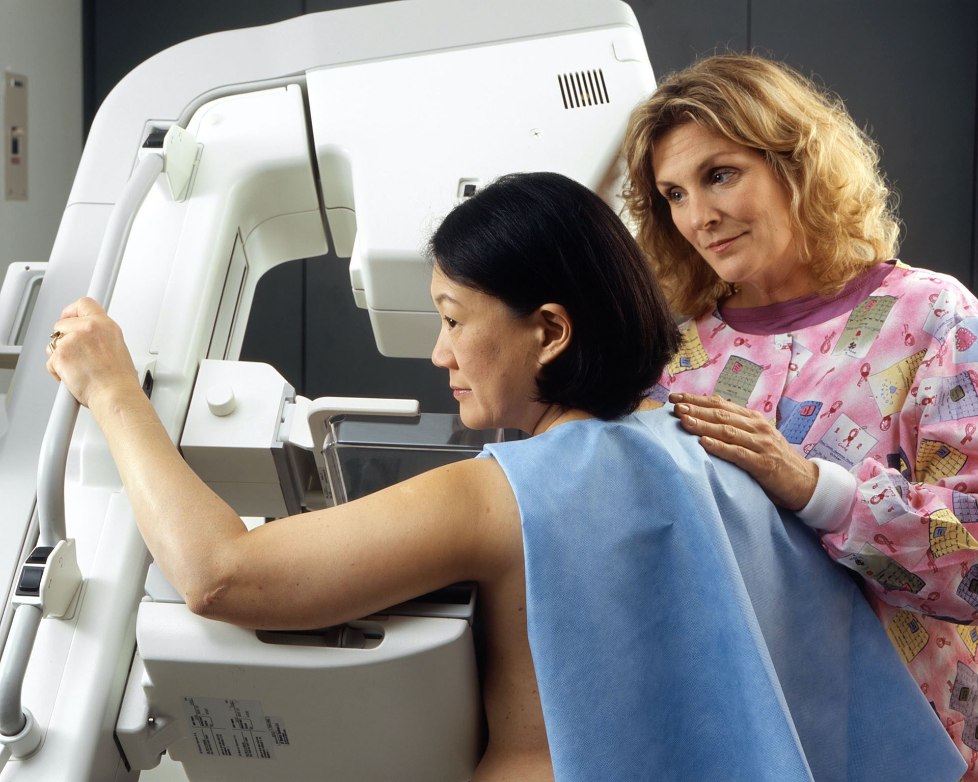 a woman receiving a mammogram