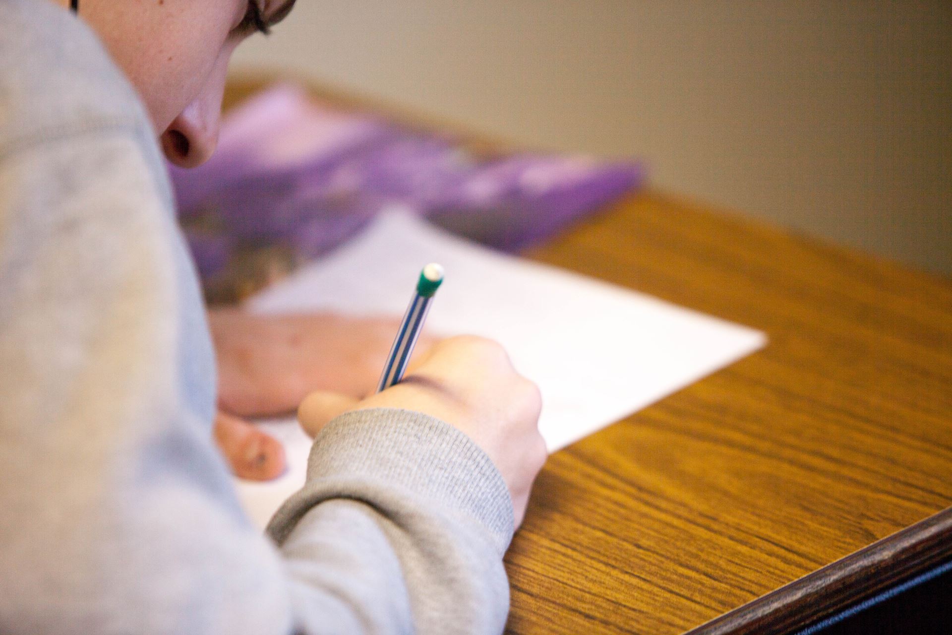 a person writing a letter